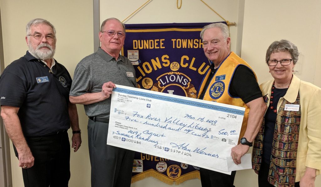 Dundee Lions members John Cichowski (far left) and Jerry Doran (third from left) presented FRVPLD Board President Richard Corbett and Library Director Roxane Bennett with a donation that will be used to fund this year’s summer reading challenge “A Universe of Stories.” — withJerry Dolan.