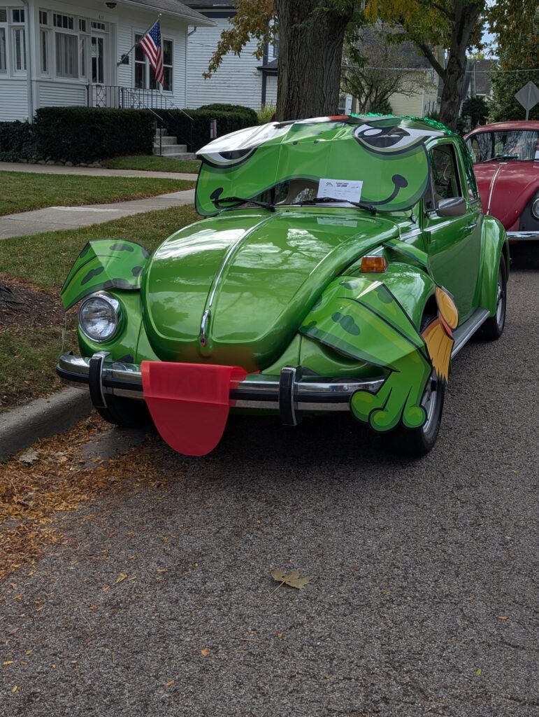 funny picture of a VW car made up to look like green frog, Front shot