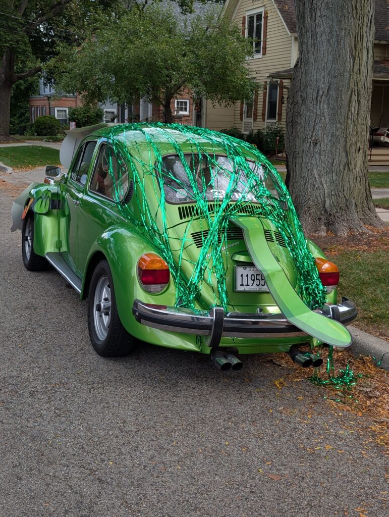 funny picture of a VW car made up to look like green frog, front shot